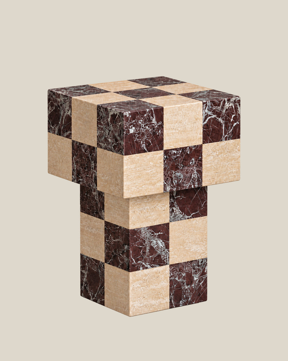 BUTTER side table by CARVINGS in Chequered Rosso Levante & Travertine Beige, on a BONE background, left view.