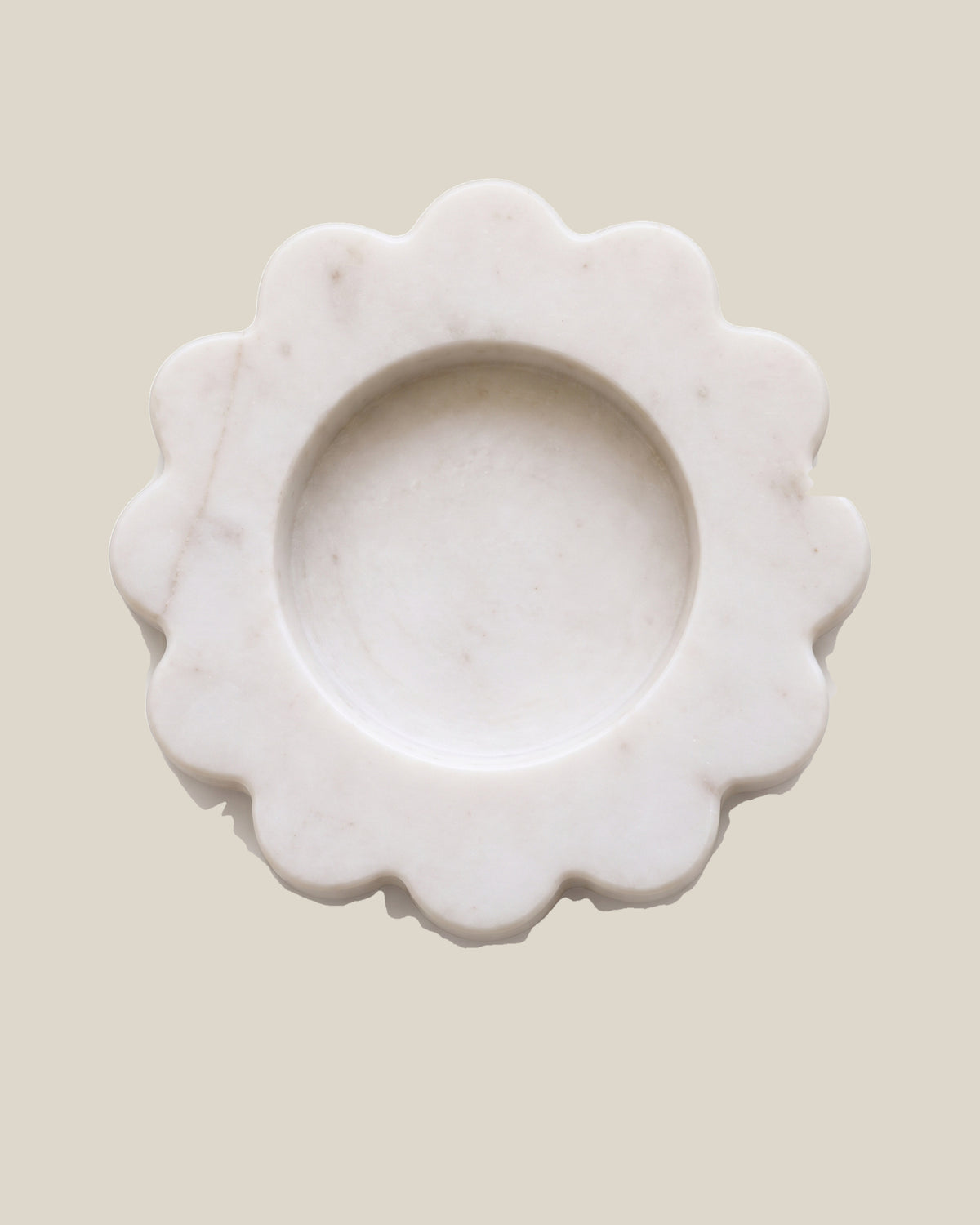 ATOMS Mini Sun Tray in White Thassos, near-top view on BONE background; 12.5 cm diameter and 2 cm thick.