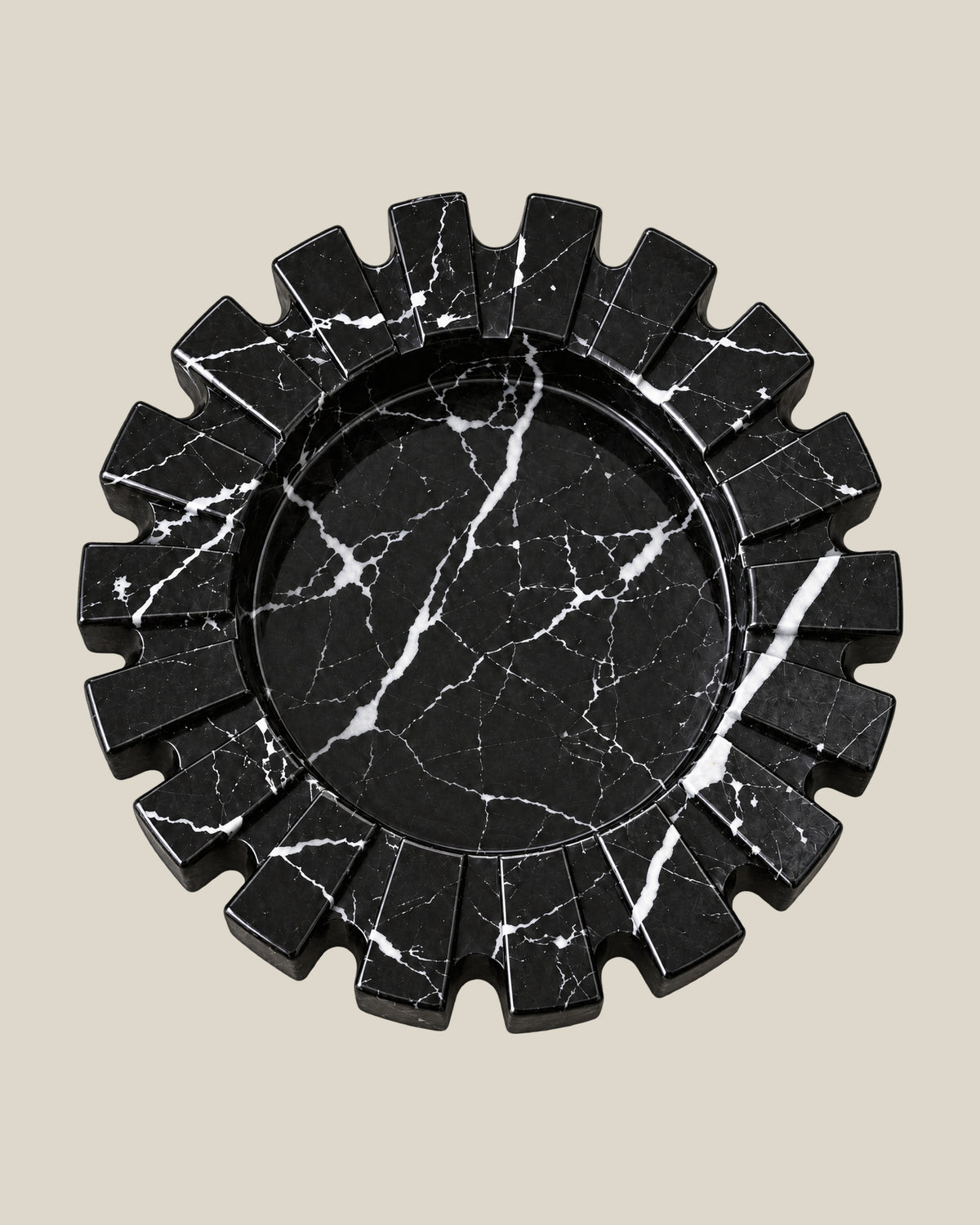 Aston Ash Tray in Spanish Black Marble, high-angle view of its circular centre and natural white veining.