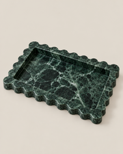 Three-quarter view of the Wide Tiffany+ Tray in Green Marble, showing scalloped edges and recessed centre.