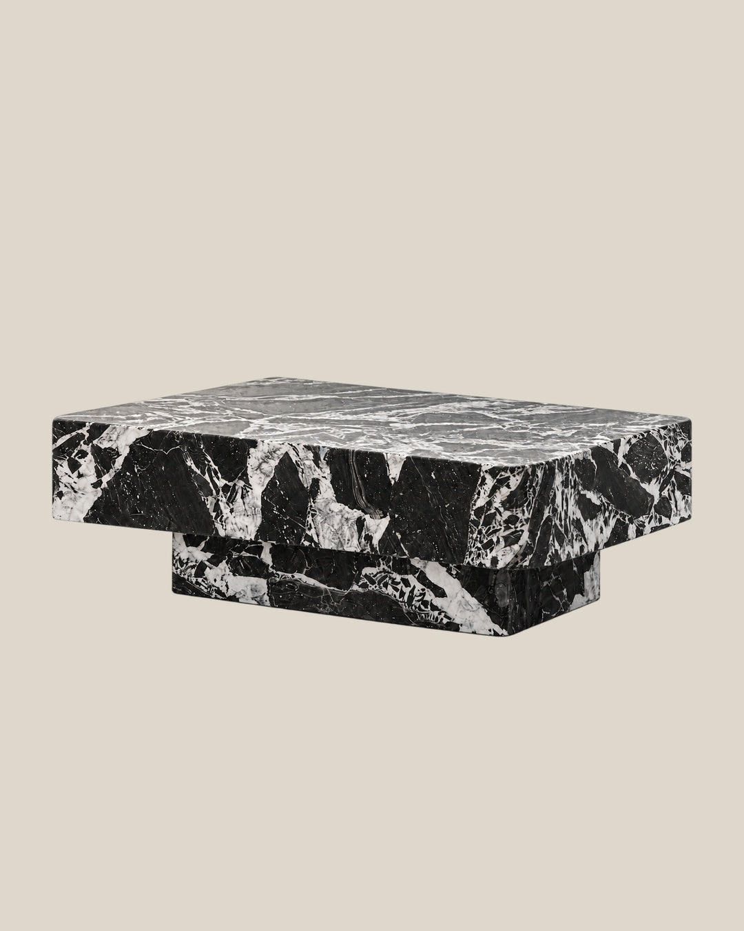 BUTTER coffee table by CARVINGS in Grand Antique Black Marble, on a BONE background, right view.