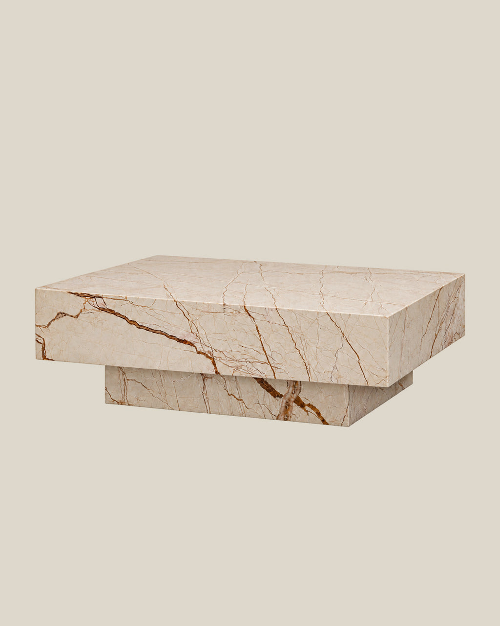 BUTTER coffee table by CARVINGS in Sofita Beige Marble, on a BONE background, left view.