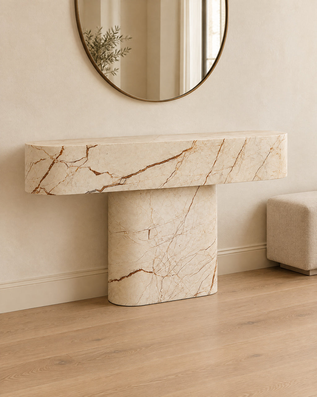 BUTTER console table by CARVINGS in Sofita Beige Marble, in a styled interior, left view.