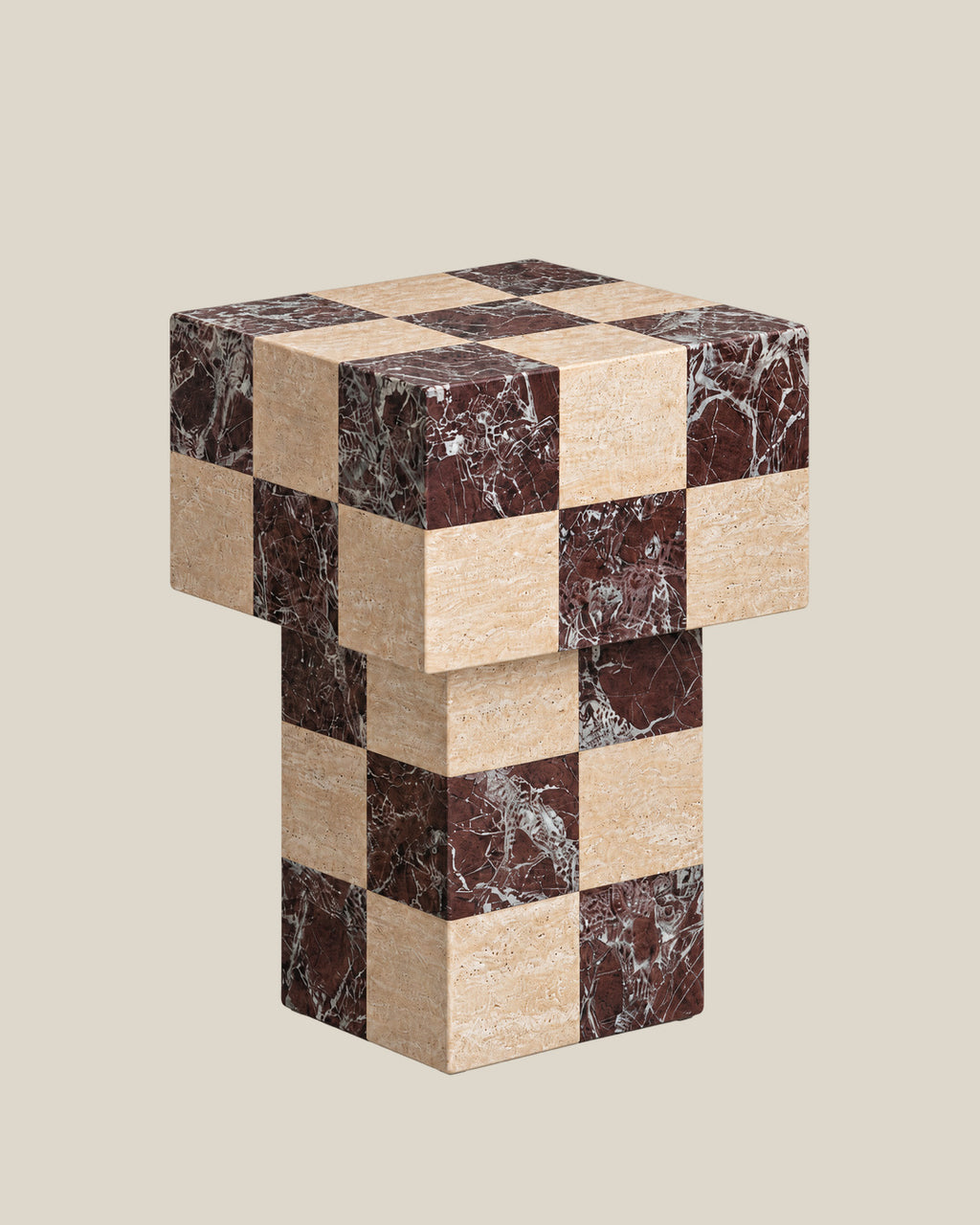 BUTTER side table by CARVINGS in Chequered Rosso Levante & Travertine Beige, on a BONE background, right view.