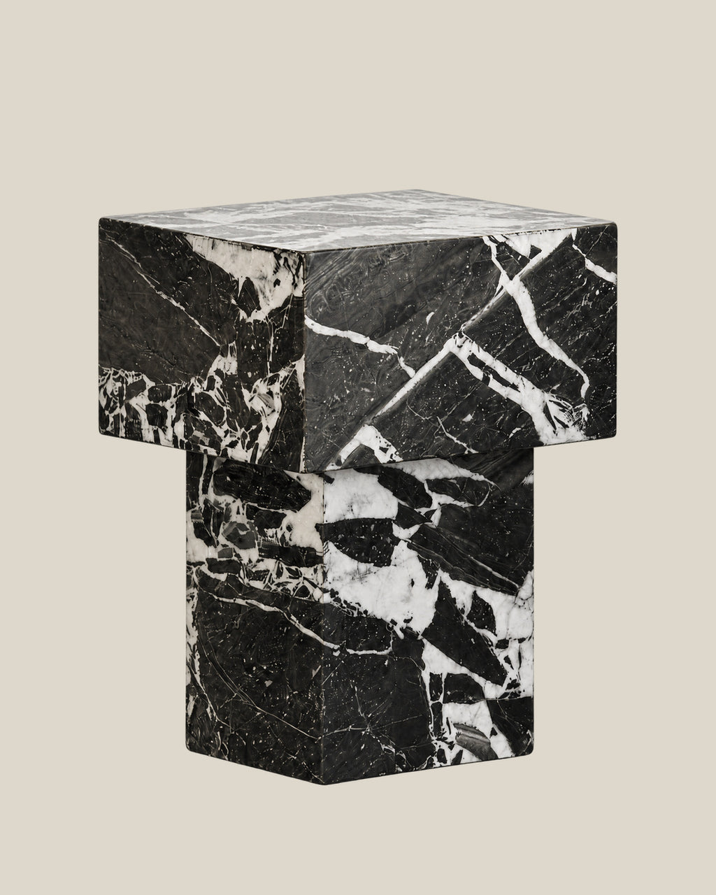 BUTTER side table by CARVINGS in Grand Antique Black Marble, on a BONE background, right view.