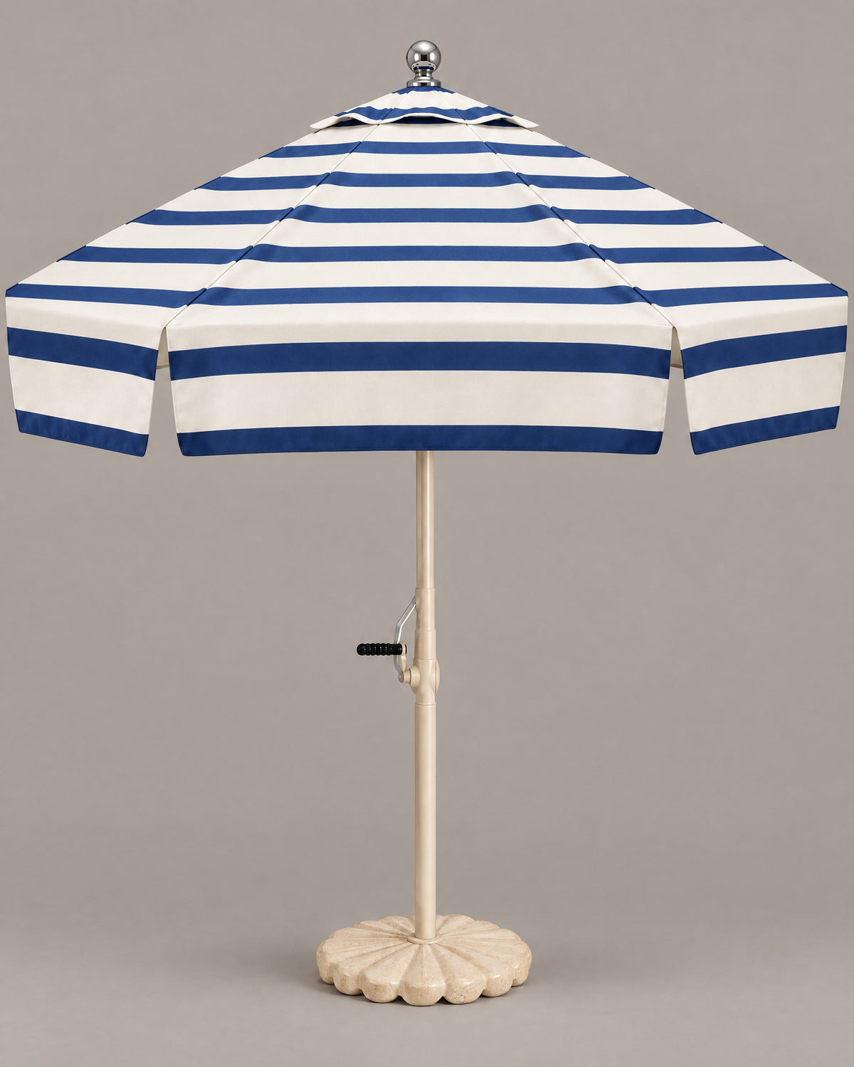 Riviera fully striped navy and ivory umbrella in a warm grey studio
