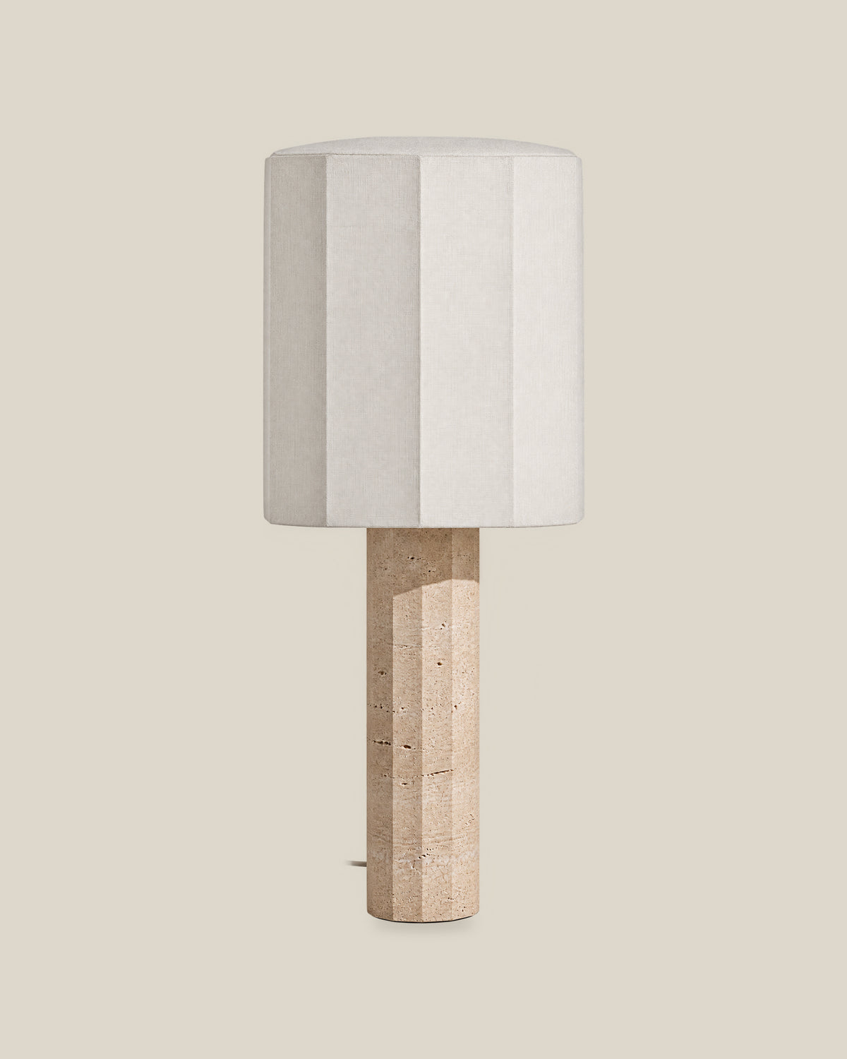 Roma Table Lamp, Large Faceted, Travertine Beige + White, front hero view on bone background.