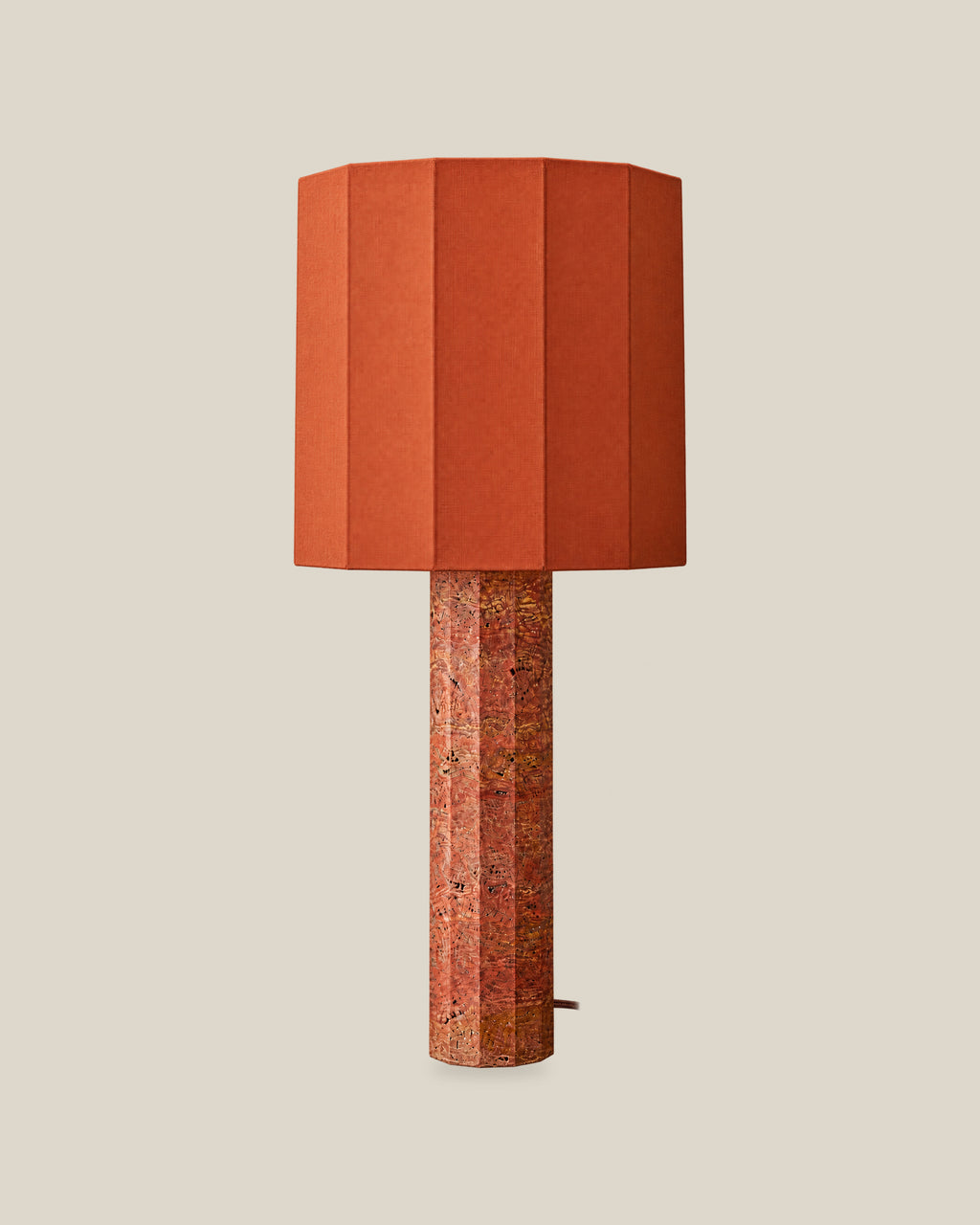 Roma Table Lamp, Large Faceted, Travertine Red + Terracotta, front hero view on bone background.