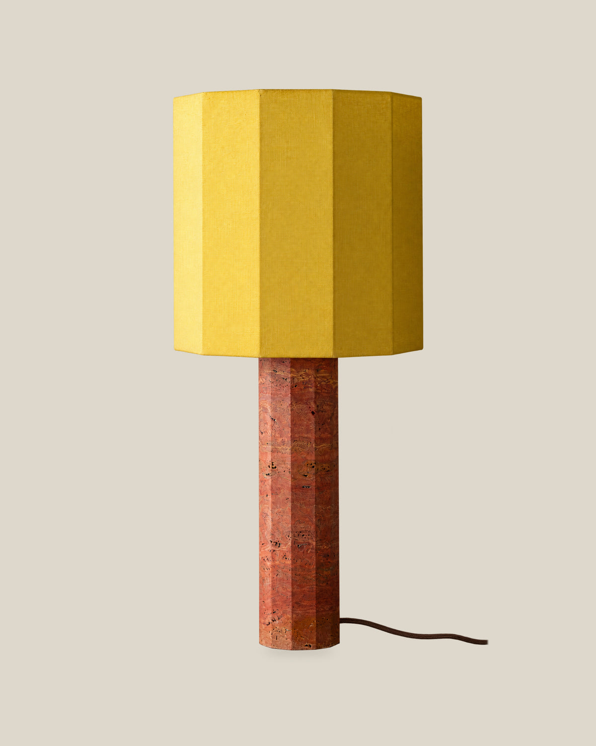 Roma Table Lamp, Large Faceted, Travertine Red + Yellow, on a bone background.