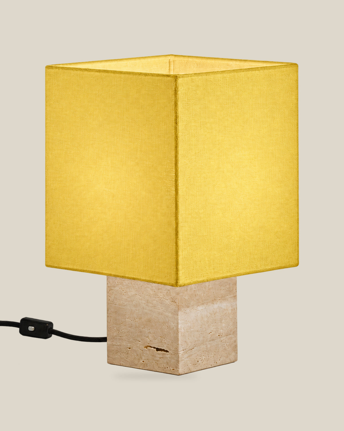 Roma Table Lamp, Small Square, Travertine Beige + Yellow, on a bone background.