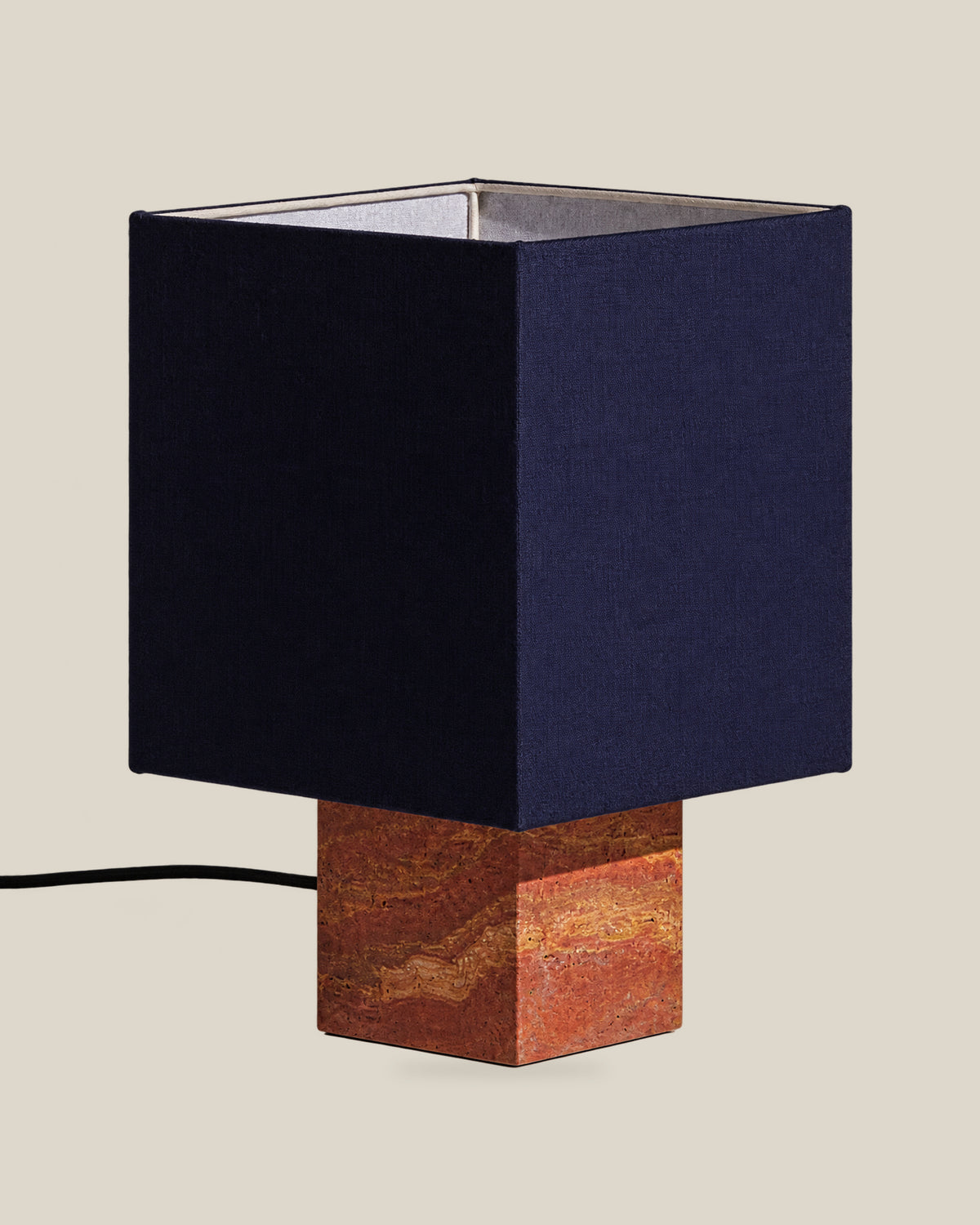 Roma Table Lamp, Small Square, Travertine Red + Dark Blue, on a bone background.