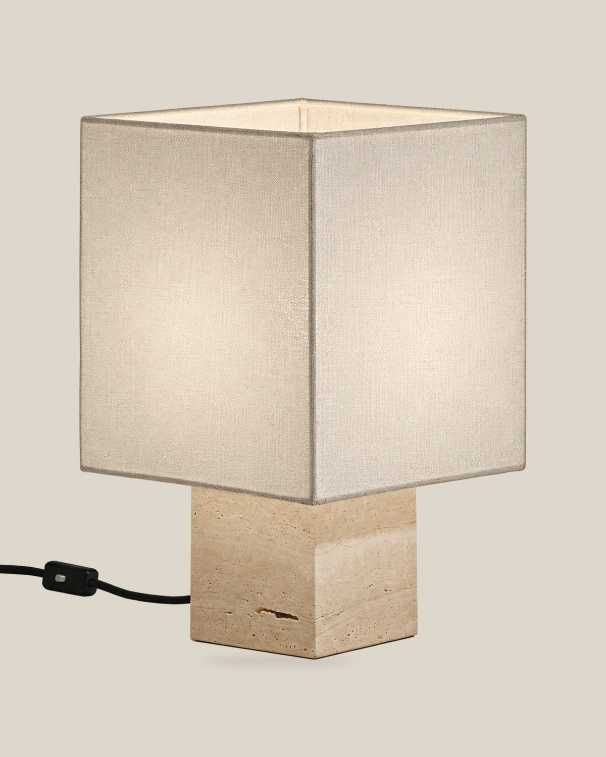 Roma Table Lamp, Small Square, Travertine Beige + White, on a bone background.
