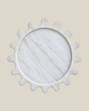 Sun Orbit Tray in Calacatta Gold natural marble, overhead view, rounded sun rays and recessed circular centre.
